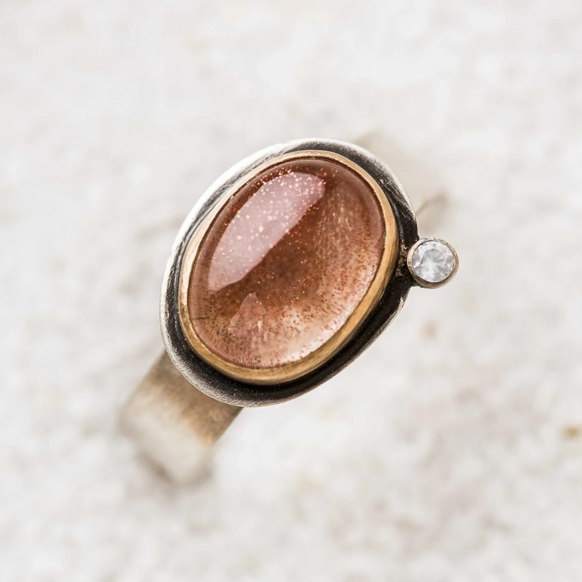 Oregon Sunstone East-West Ring with White Topaz