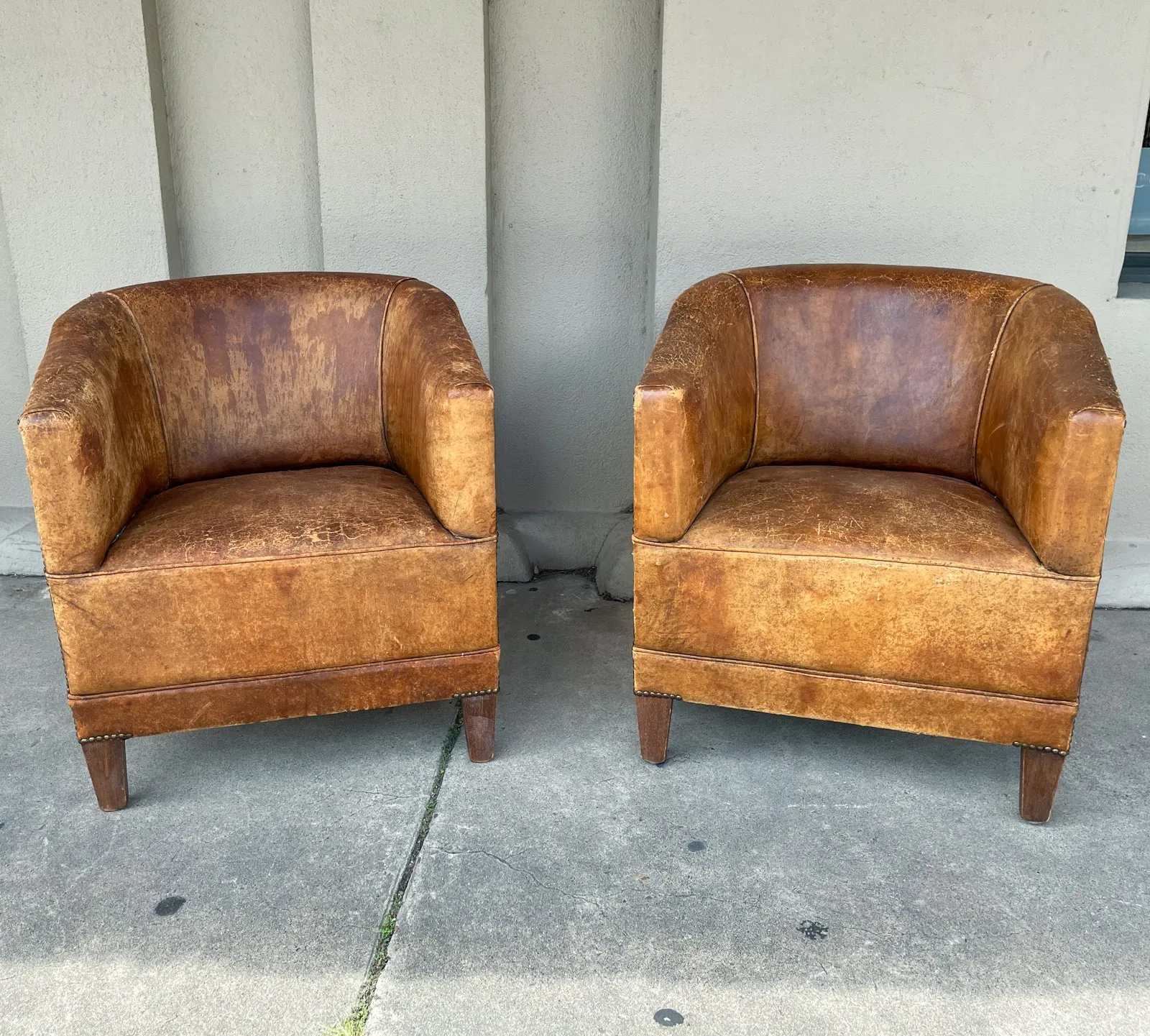 Pair Vintage European Leather Tub Chairs with Brass Nailhead Detail