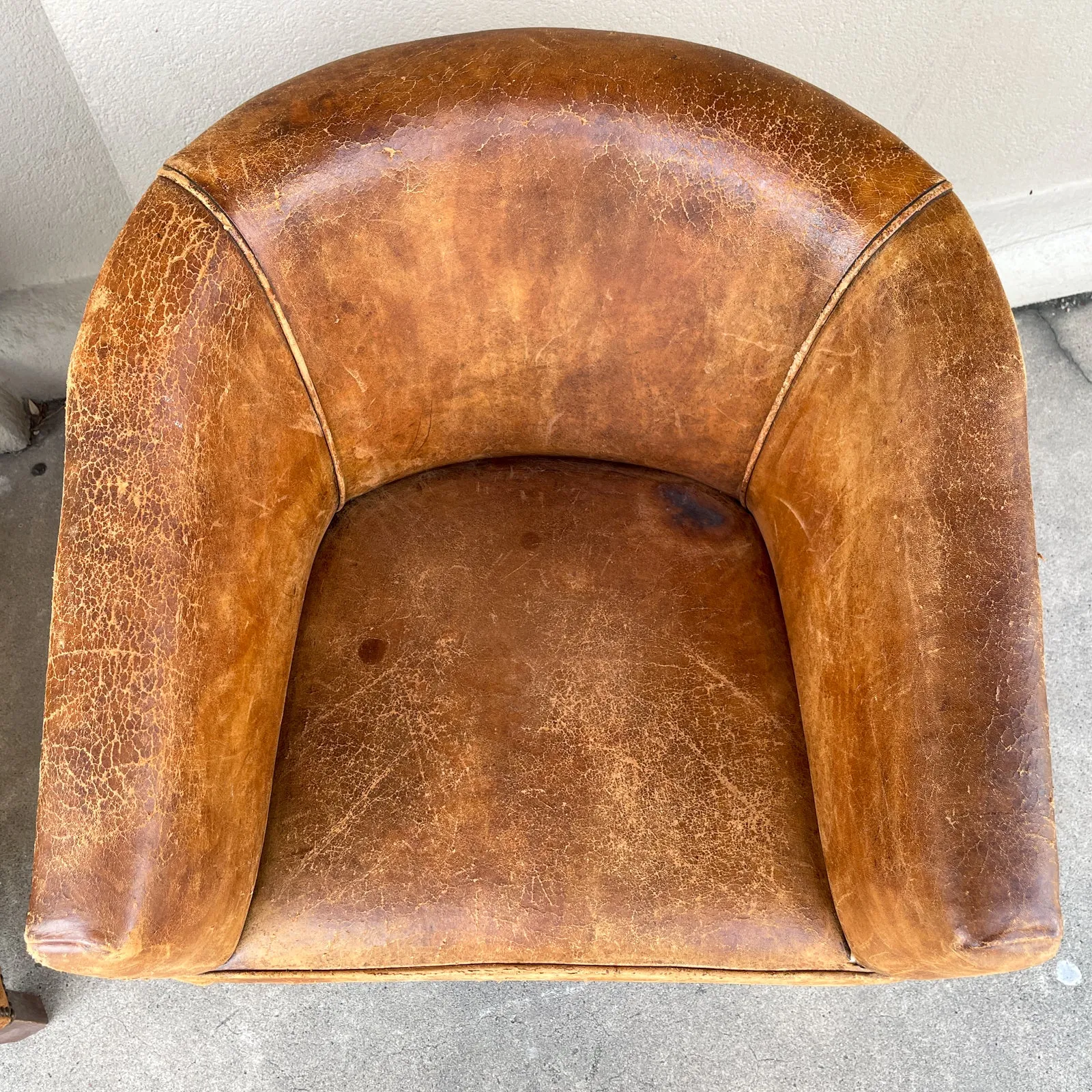 Pair Vintage European Leather Tub Chairs with Brass Nailhead Detail