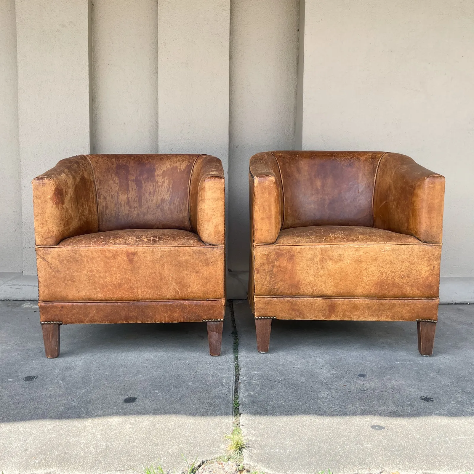 Pair Vintage European Leather Tub Chairs with Brass Nailhead Detail