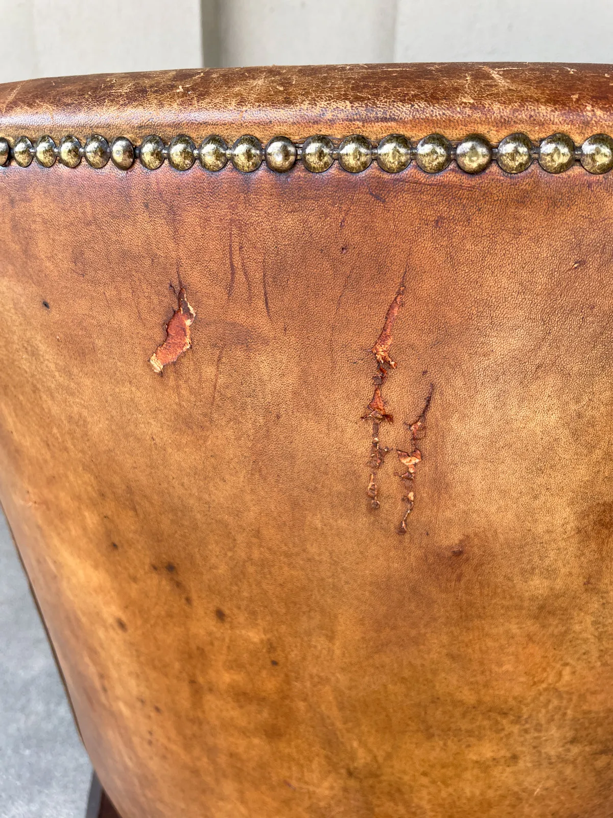 Pair Vintage European Leather Tub Chairs with Brass Nailhead Detail