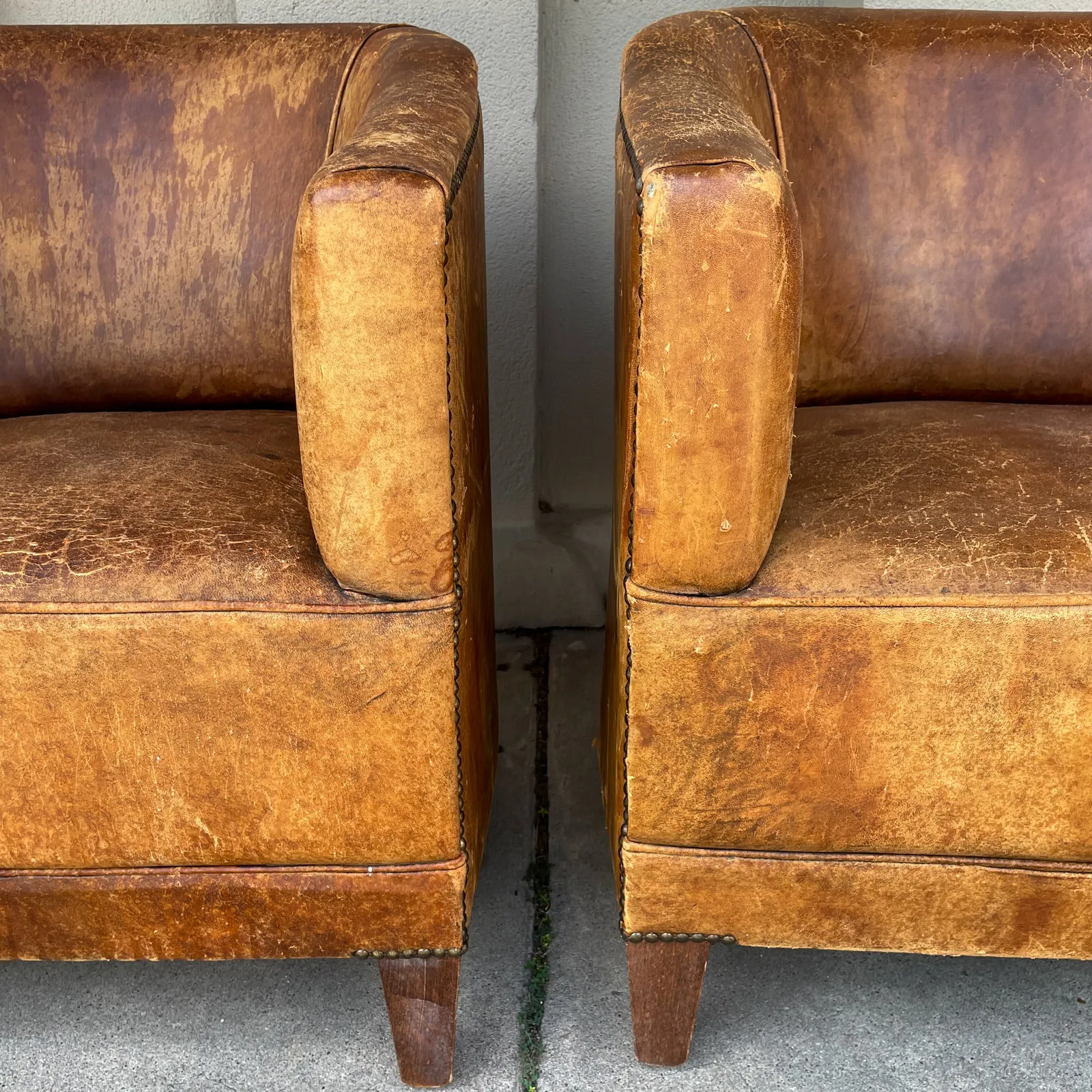 Pair Vintage European Leather Tub Chairs with Brass Nailhead Detail
