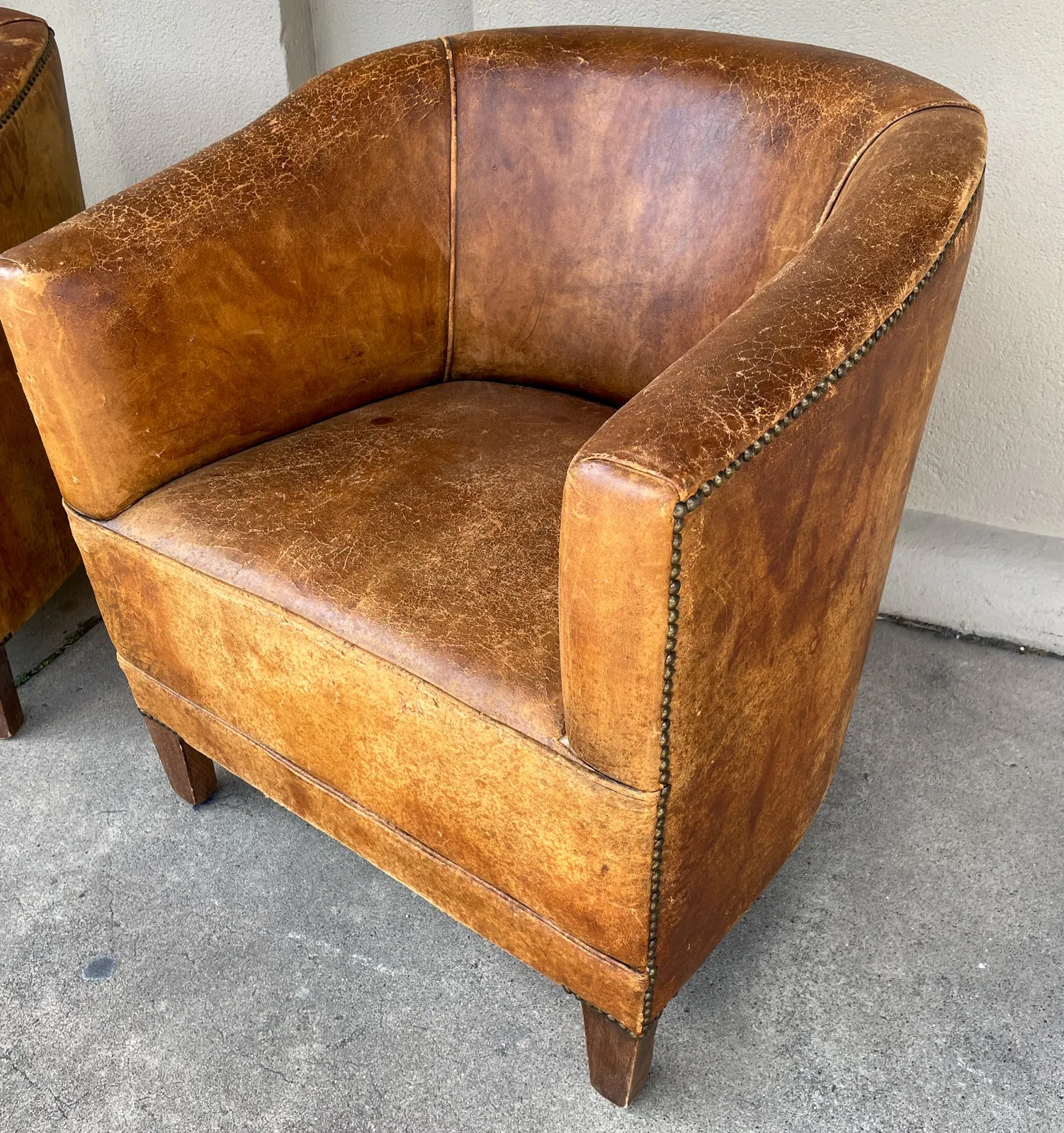 Pair Vintage European Leather Tub Chairs with Brass Nailhead Detail