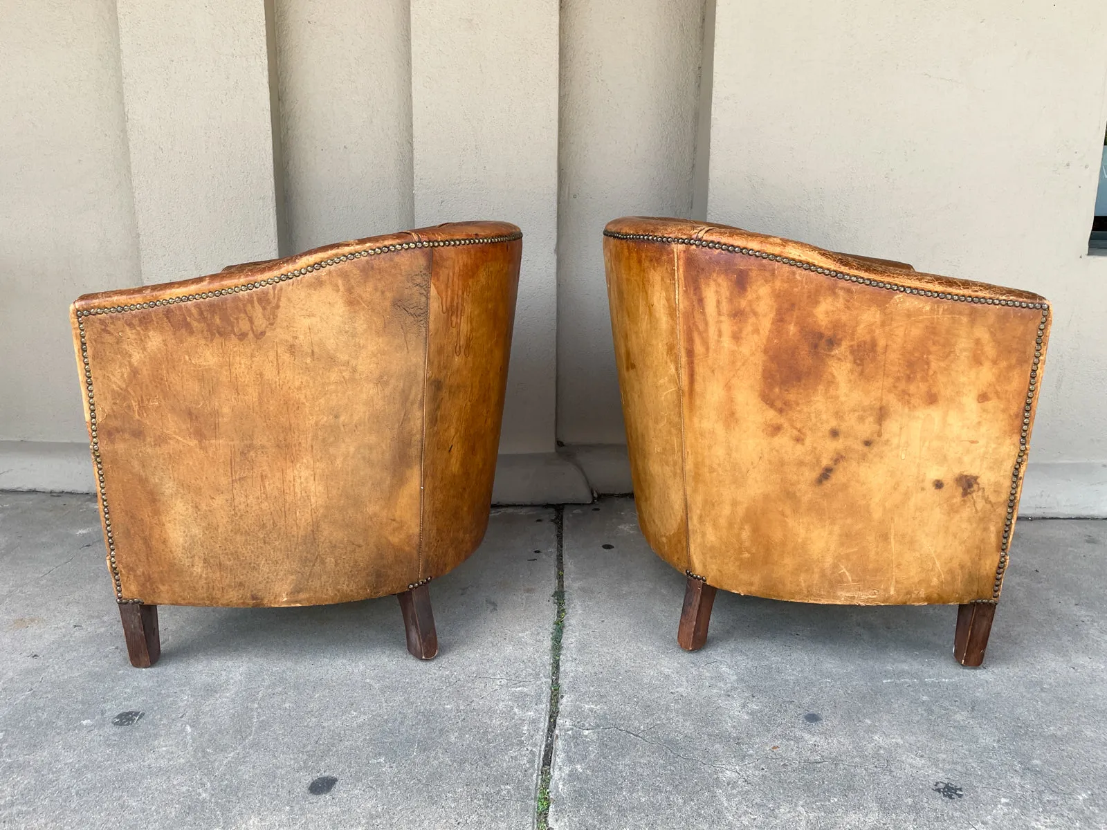 Pair Vintage European Leather Tub Chairs with Brass Nailhead Detail