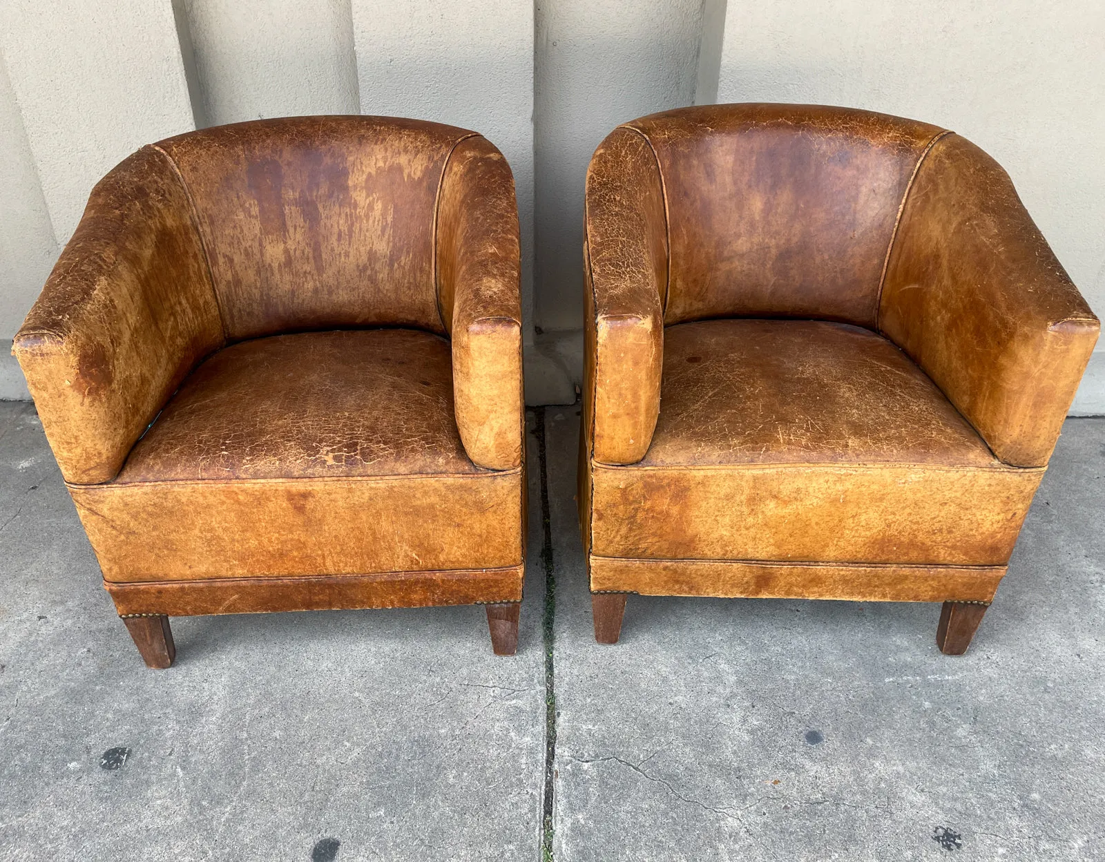 Pair Vintage European Leather Tub Chairs with Brass Nailhead Detail