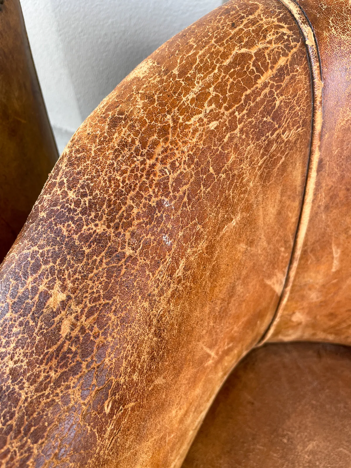 Pair Vintage European Leather Tub Chairs with Brass Nailhead Detail