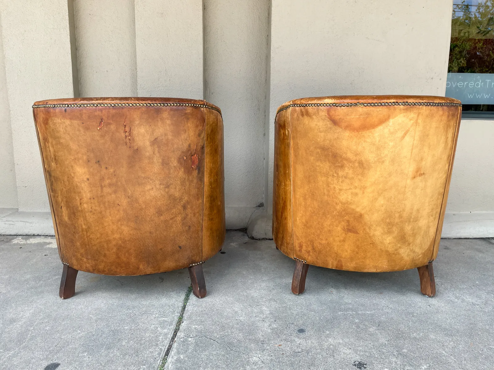 Pair Vintage European Leather Tub Chairs with Brass Nailhead Detail