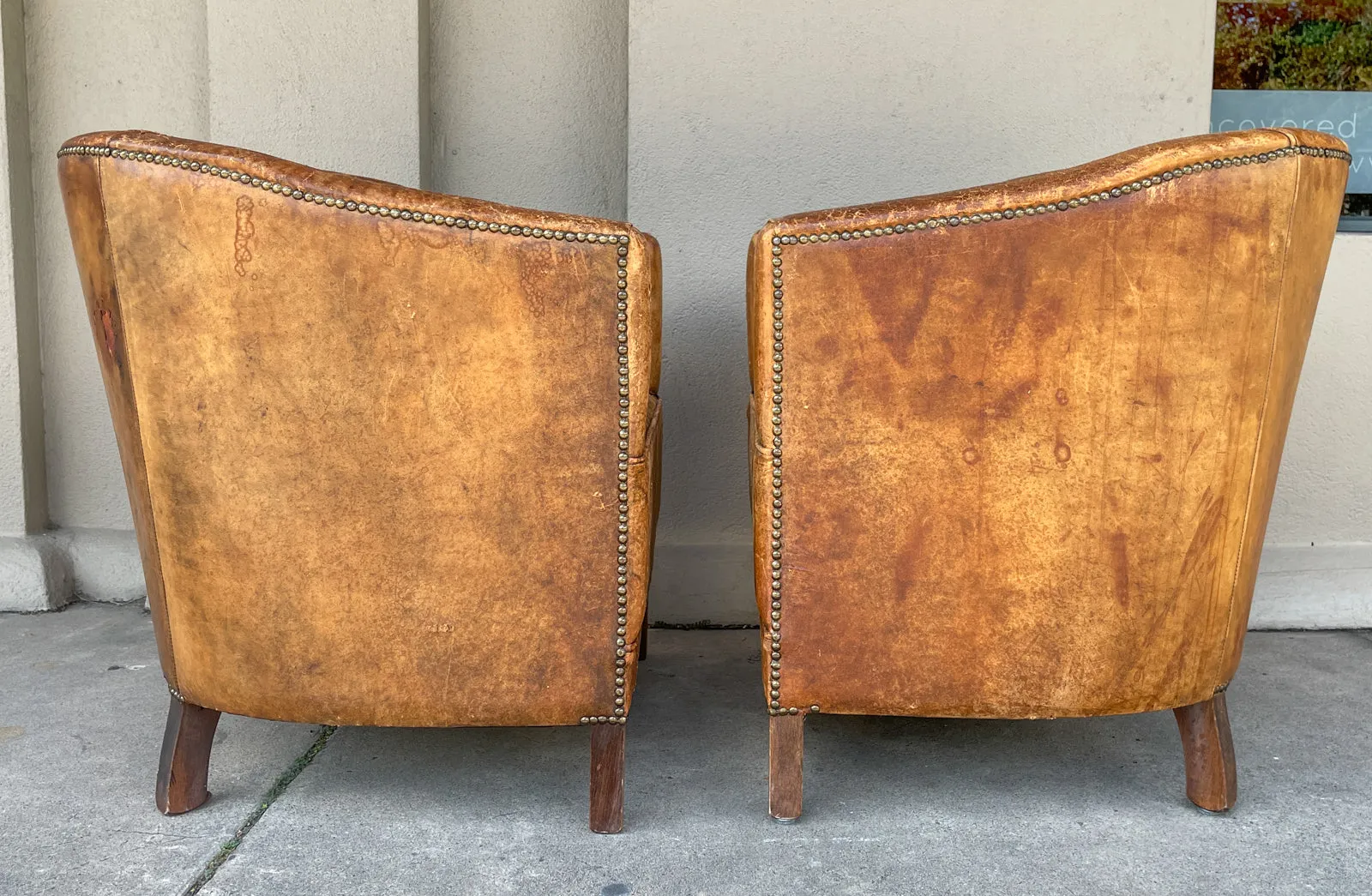 Pair Vintage European Leather Tub Chairs with Brass Nailhead Detail