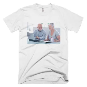 Smiling seniors using a laptop